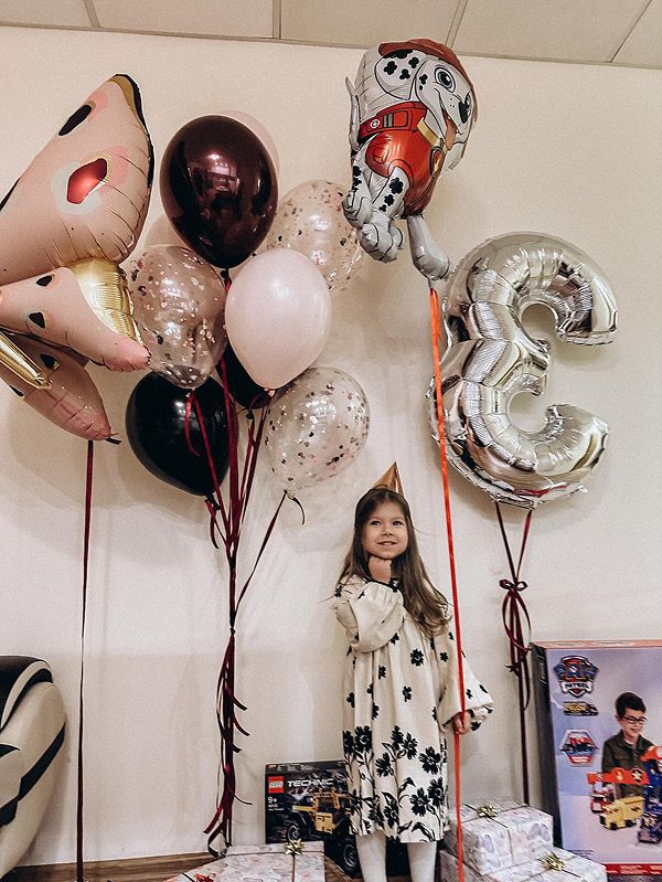 Little girl with balloons for her party