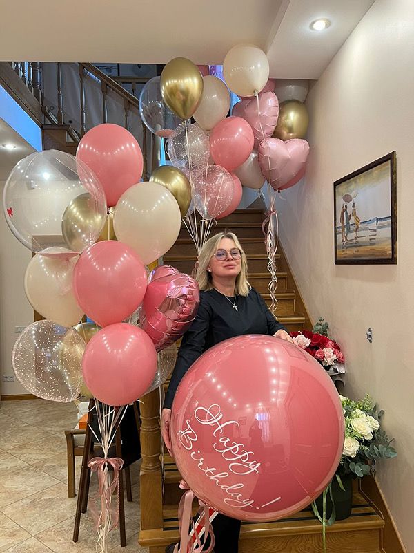 Happy woman with birthday balloons