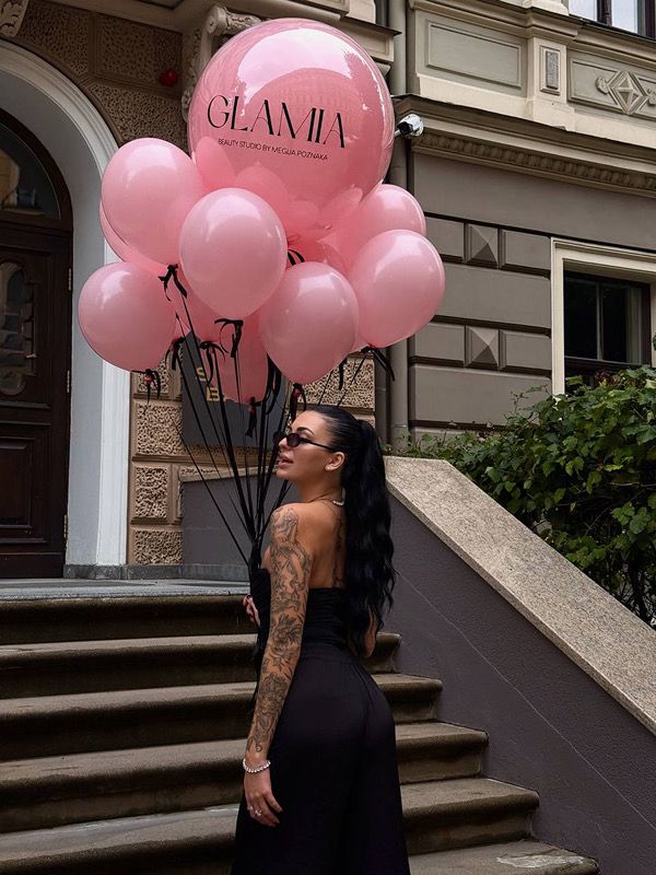 Woman with bunch of balloons